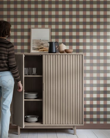 Earthy multicolor plaid wallpaper with a rustic check pattern, styled with natural wood furniture