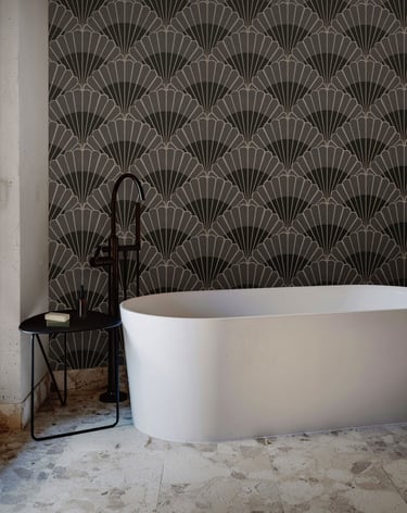 Charcoal and grey Art Deco wallpaper with bold fan motifs, styled in a modern bathroom with a freest