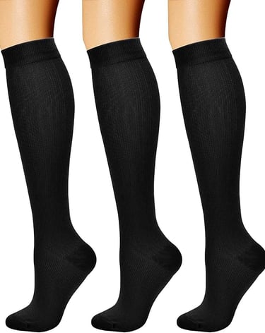 three pairs of socks with black and white socks