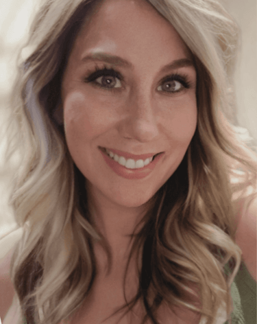 a woman with blonde hair and a green dress