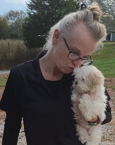Lady kissing Female Mal-Shi Pup