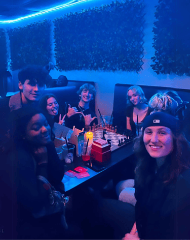 Group of friends laughing and enjoying kava drinks at Kava Bar LA. & Botanical Lounge
