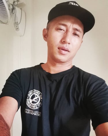 man wearing a cap taking a selfie