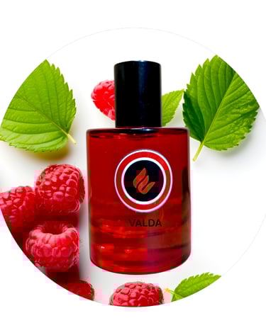a bottle of valadaa perfume with raspberries and raspberries