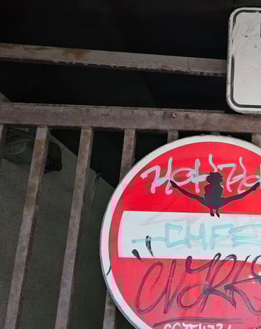a clock with graffiti on it and a sign that says,