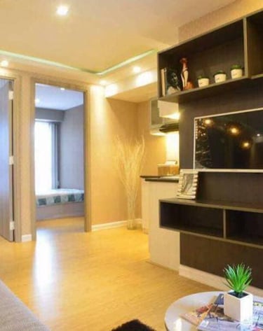 a living room with a couch and a television