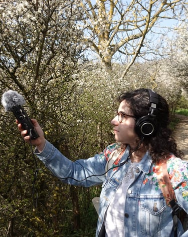 Federica doing some field recording in a forest