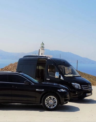a van parked on a hill with a lighthouse in the background
