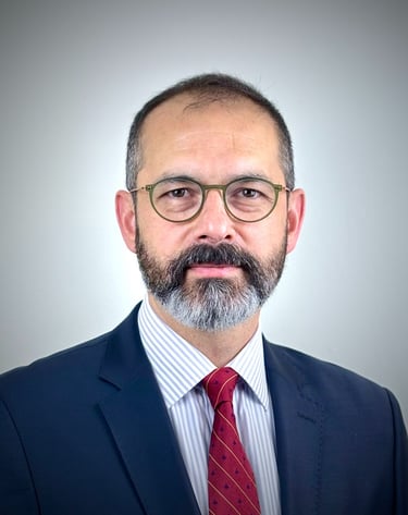 a man with a beard and glasses on a white background