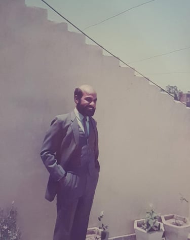 Ravinder Vashisht surrounded by potted plants
