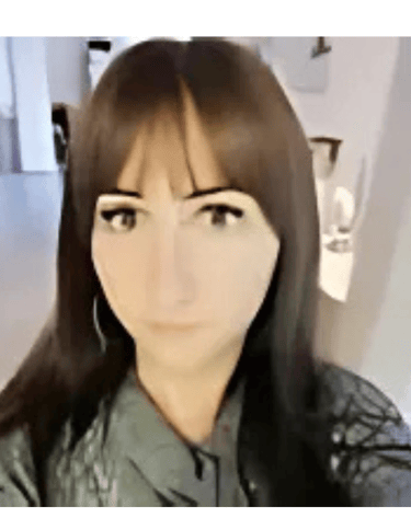 a woman with long hair and a green shirt