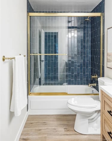 Modern cleaned bathroom with gold accents in Denver home by SparkEaseCleaning