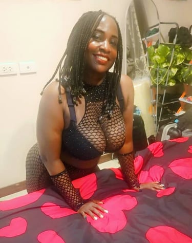 Black lady wearing sexy black bra and fishnet outfit