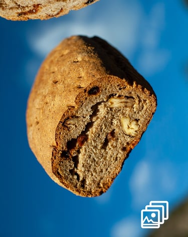 a piece of bread flying with a slice of bread the top of it