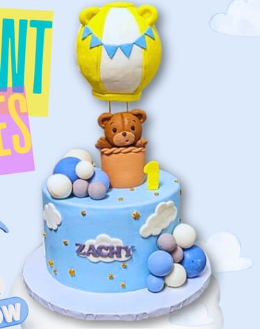 a cake with a bear and a balloon