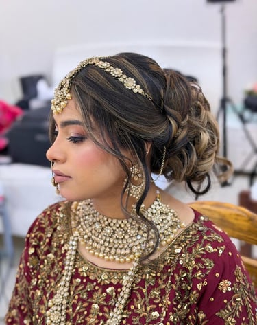 a woman in a red and gold outfit with a gold headpiece, Bridal Makeup Dubai Marina