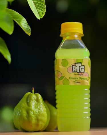 a bottle of fruit juice with a pear tree in the background