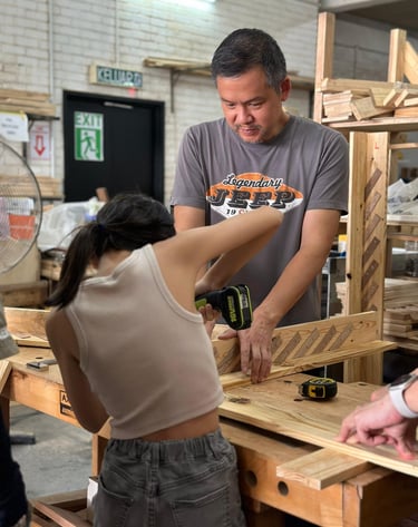 a man and a girl making a dog shelter