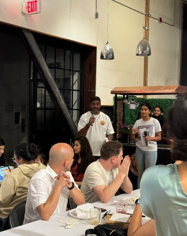 Bollywood Trivia night with hosts asking questions in Chai tea shirts