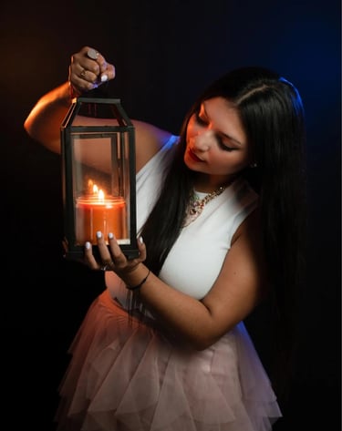 a woman holding a candle in a lantern light