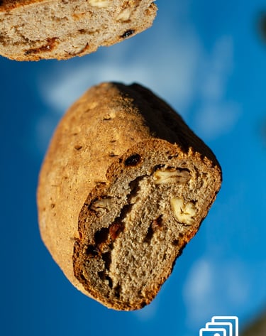 a piece of bread flying with a slice of bread the top of it