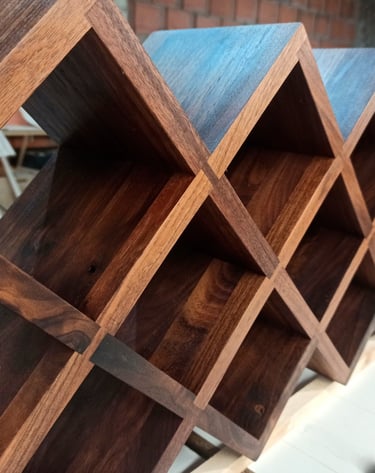 Custom wooden wine rack perfectly fitting inside a stylish living room cabinet, showcasing expert craftsmanship.
