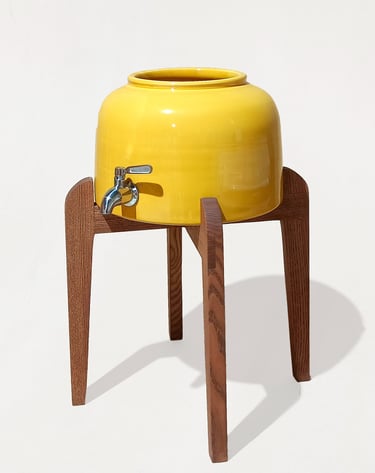 Elegant ceramic water dispenser compatible with 5-gallon US containers, standing out as a high-quality alternative.