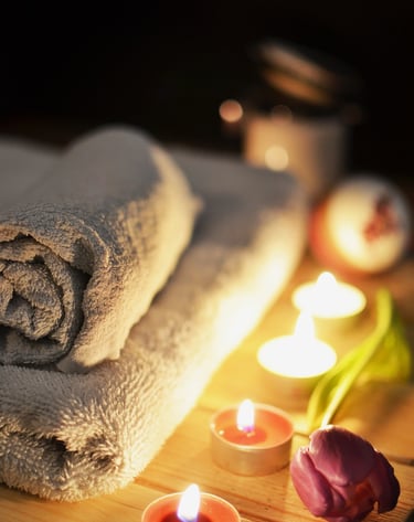 a towel on a table with candles and candles