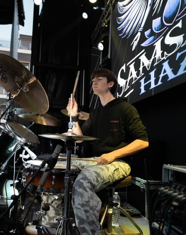 a man playing drums in a band