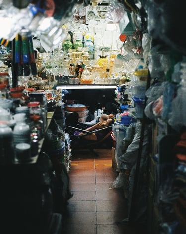 Market vendor relaxing in Saigon