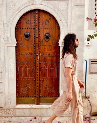a man walking down a sidewalk 