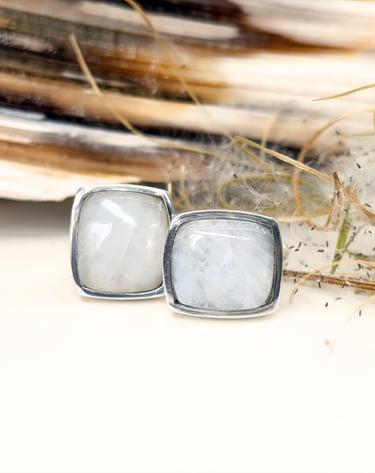Custom Cut White Quartz Cabochons set in a pair of sterling silver hand fabricated cuff links