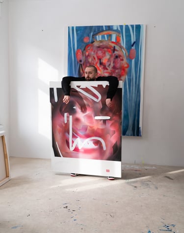 Contemporary artist in his studio leaning over a large abstract expressionist oil painting.