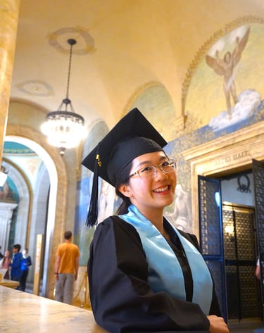 a woman in a graduation gown and cap - toe shoes
