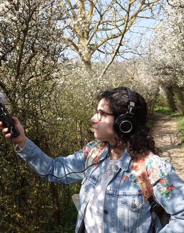 Federica doing some field recording in a forest