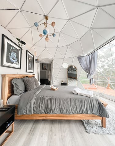 a bedroom with a bed and a large bed