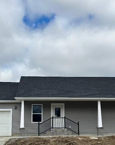 a house with a garage door and a garage door