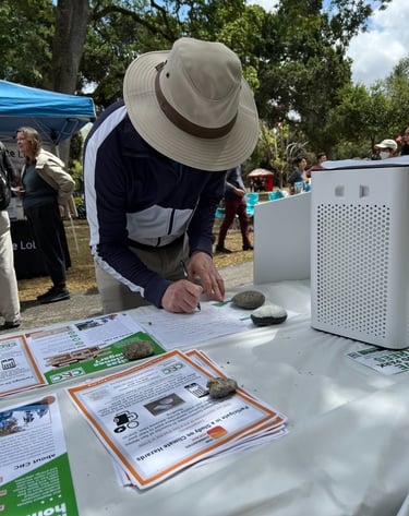 A person filling out a form at a table