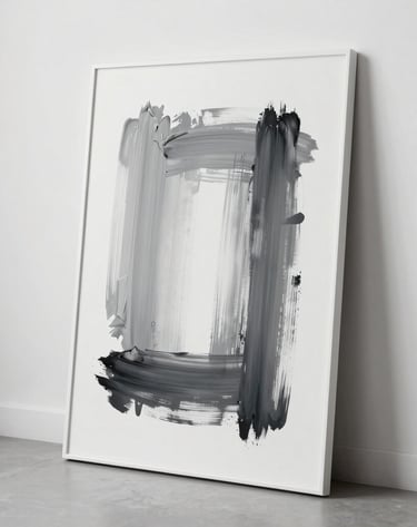 A secondary minimalist artwork with grey and black brushstrokes on a white background, leaning against a clean white wall in a contemporary studio space.