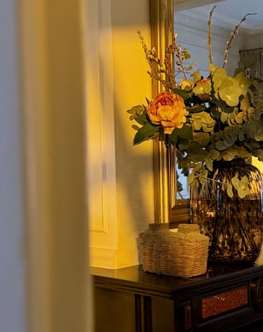 Antique woven basket vase with dual clay spouts and aged texture in dramatic lighting.