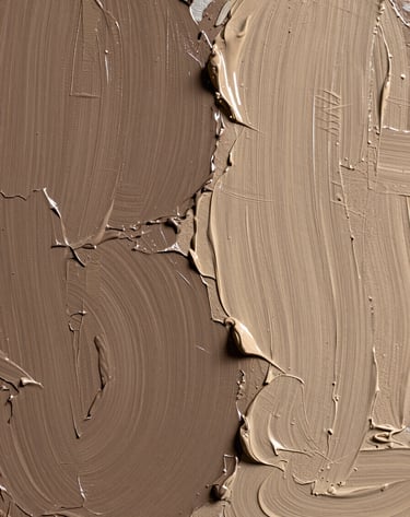 A close-up photograph of oil paint texture on a canvas. Thick impasto strokes in muted brown and soft sand colors create a tactile, organic surface. Side lighting highlights the relief of the paint.