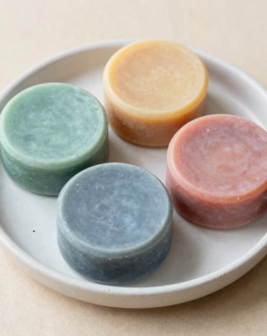 Massage soaps with smooth curves and creamy textures displayed alongside lavender sprigs.