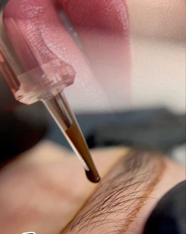 Professional permanent lip & brows makeup procedure using precision needle at Glam S Beauty.