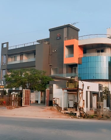 Rini Hospital Dholpur a building with a building in the background