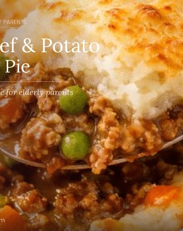 Soft beef and potato cottage pie with peas and carrots, an easy batch cook meal for elderly parents.