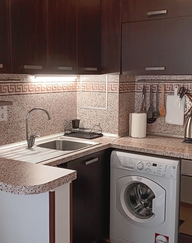 alt="Serenity Apartment fully equipped kitchen for guests"