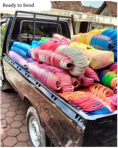 Handmade plastic woven bags loaded and ready for delivery to customers and partners