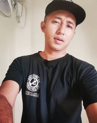 Male therapist wearing a cap taking a selfie