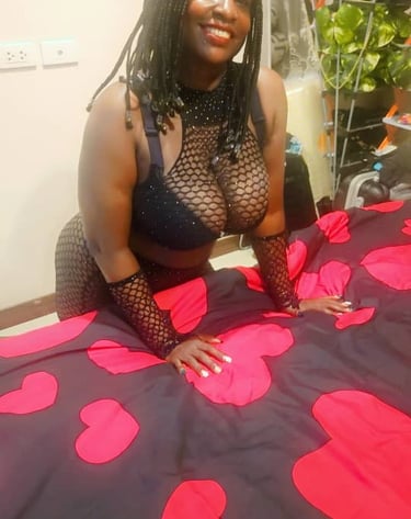 Black lady wearing sexy black bra and fishnet outfit