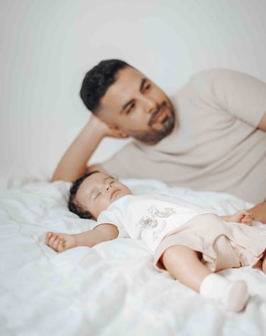 Father and baby relaxing on bed – Fred Art Studio home session